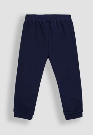 Navy blue cotton pants with an elastic waistband, tapered cuffs, and a smooth texture. Simple design, no patterns or embellishments.