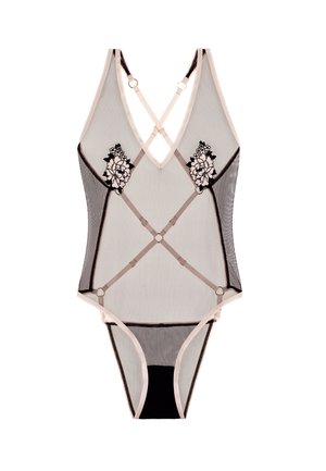 Bodysuit noir et nude en mesh transparent, orné de broderies florales, comportant des bretelles croisées et un design de string avec des accents contrastants.