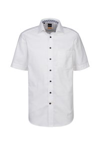 Camicia bianca a maniche corte in cotone. Caratterizzata da una chiusura con bottoni sul davanti con bottoni blu a contrasto e una tasca sul lato sinistro.