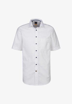 Kurzes weißes Hemd aus Baumwolle. Mit einer Knopfleiste vorne und kontrastierenden blauen Knöpfen sowie einer Tasche auf der linken Seite.