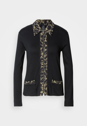 Black zip-up jacket with a camouflage-patterned collar and front panel, featuring two front pockets with matching details. Long sleeves.