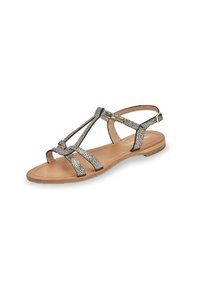 Sandali piatti con suola in pelle marrone. Le cinghie presentano una texture metallica argento, con design a T e fibbia alla caviglia per la regolazione.