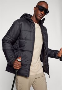 Vaude NEYLAND HOODED  - Winterjas - black