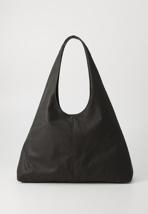 Black leather tote bag with a curved handle, elongated triangular shape, and smooth texture. Features minimalist design with no visible hardware.