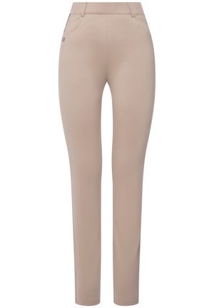 Beige enganliegende Hose aus elastischem Stoff, mit Fronttaschen und schmalem Bein-Design sowie einem dezenten Logo-Detail an der Hüfte.