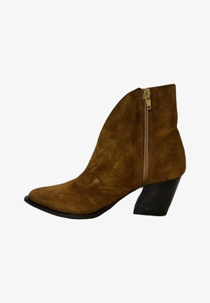 Brown suede ankle boot with a pointed toe, side zipper, and a short black heel. Features decorative stitching on the upper.