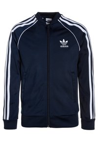 Navy blue track jacket made of polyester with white stripe accents, zip front, ribbed cuffs, and logo on the left chest.