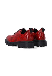 Red, crocodile-embossed leather shoes with a black rubber sole. Features round toe, textured upper, and pull tabs on the heel.