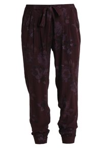 Pantalons à motif floral de couleur violet foncé avec une taille élastique et un cordon à nouer. Les chevilles serrées et la coupe ample améliorent le confort.