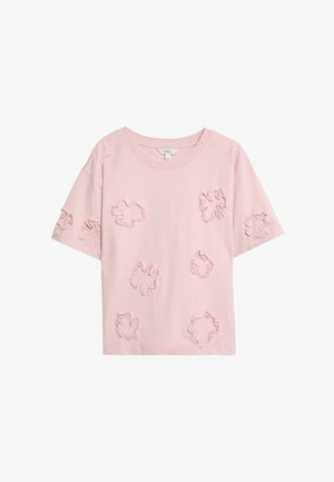 Lyserød bomulds T-shirt med en afslappet pasform, der har teksturerede blomsterapplikationer i forskellige størrelser over hele stoffet. Korte ærmer.