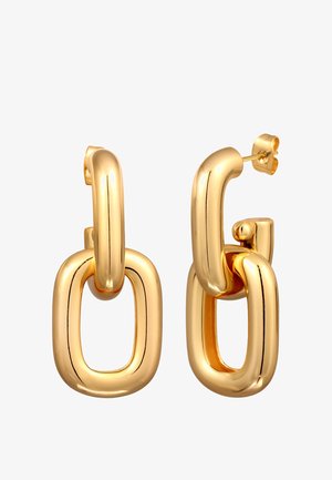 Goldfarbene Metallohrringe mit einem skulpturalen, überlappenden Design, das eine glatte Oberfläche und leicht abgerundete Kanten aufweist.