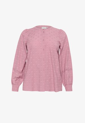 Šviesiai rožinė mygtukinė bluzelė, su pūstučiais rankovėmis, tekstūruotu gėlių raštu ir nėriniu apibrištomis rankovėmis. Pagaminta iš minkštos medžiagos.