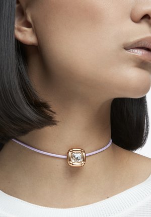 Choker necklace with a square, rose gold accent and a clear stone, featuring a light purple cord. Smooth texture, minimal design.