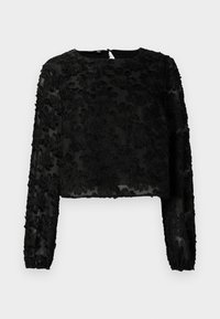 Svart avkortet bluse med lange ermer og teksturert blomsterbroderi, rund hals, og gjennomsiktig stoff. Bakre lukking synlig.