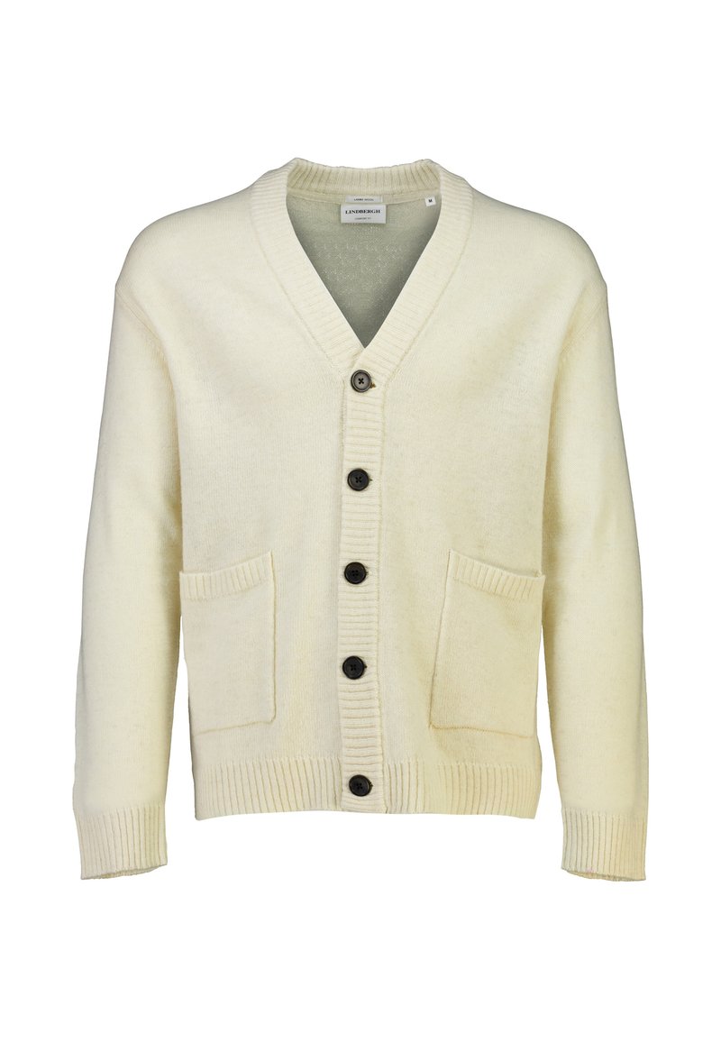 Elfenbensfärgad stickad cardigan med V-hals, ribbade ärmmuddar och två framfickor. Har fem svarta knappar framtill. Mjuk textur.