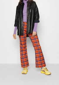 The Ragged Priest Jean flare - multi-coloured
