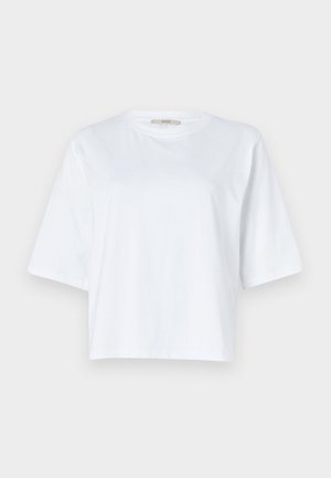 T-shirt bianca cropped in cotone. Presenta maniche corte e un colletto rotondo. Texture liscia con un design pulito e minimalista.