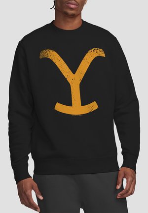Black sweatshirt featuring a distressed yellow graphic logo resembling a "Y" on the front. Made from soft fabric, with ribbed cuffs and hem.