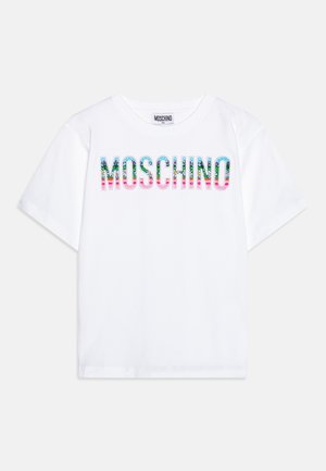 T-shirt in cotone bianco con la scritta "MOSCHINO" in lettere multicolori decorate con motivi floreali e pois. Maniche corte, scollatura tonda.