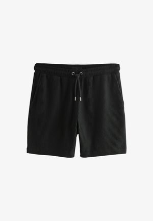 Schwarze Badeshorts mit vertikaler Rippstruktur, elastischem Bund, Kordelzug und seitlichen Taschen.