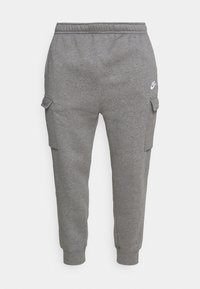 Grå bomullscargojoggers med elastisk midja, sidofickor, ribbade muddar och en liten vit Nike-logga på låret.