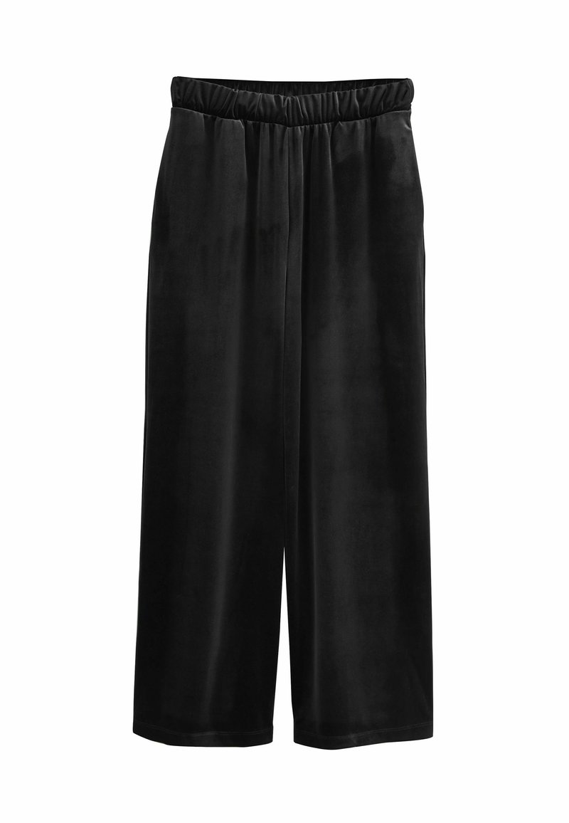 Čierne zamatové culottes s elastickým pásom, s širokým strihom, ktorý končí u polovice lýtok, s hladkou, jemnou textúrou.