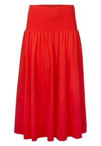 Jupe en coton rouge avec une taille smockée, de forme évasée en A, longueur genou, affichant une texture lisse et sans motifs visibles.