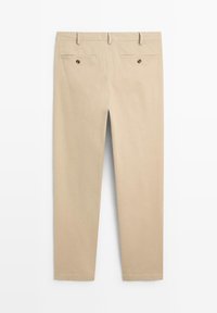 Beige chinos with a straight cut, featuring two back pockets with buttons and a smooth fabric texture. No visible patterns or accents.