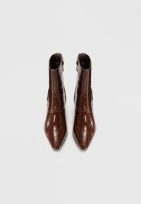 Brown faux crocodile leather ankle boots with pointed toes and a side zip closure, featuring a smooth, glossy texture.