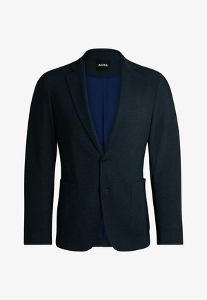 Blazer navy in tessuto testurizzato, con due tasche frontali, chiusura a un bottone e rever a punte. Interno foderato.