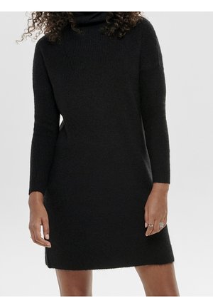 Abito a maglia nero con colletto alto e maniche lunghe, caratterizzato da una texture morbida e una silhouette dritta, che termina sopra la metà della coscia.