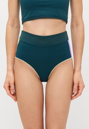 High-waisted bikini bottoms in dark green with multicolored side panels (orange and purple) and a contrasting light beige trim.