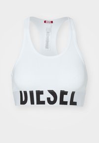 Witte sportbeha met een brede zwarte band waarop de tekst "DIESEL" in vette letters staat. Gladde stof, racerback ontwerp, minimale stikseldetails.