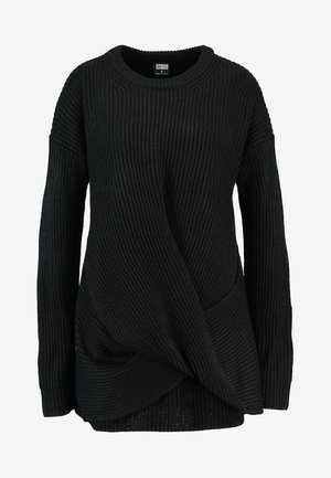 Mustmustribade sokk, millel on ripsme muster, ebatasane kätkesüsteem ja lai ümar kaelus koos pikkade varrukatega.