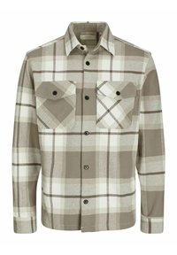Camicia a quadri marrone e beige realizzata in tessuto morbido, con due tasche sul petto con patta e bottoni e colletto con bottoni neri.