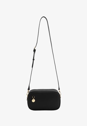 Black rectangular crossbody bag with adjustable thin strap, gold zipper pulls, and a small round gold charm on front.