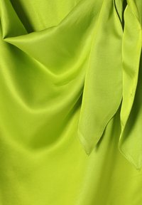 Bright green satin fabric with a smooth texture, featuring loose drapes and a tied accent. Edges are cleanly finished with no patterns.