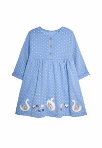 Vaaleansininen mekko, jossa on valkoisia pilkkuja, pyöreä pääntie, kolme puupainiketta sekä brodeerattuja joutsenia ja kukkakuvioita helman reunassa.