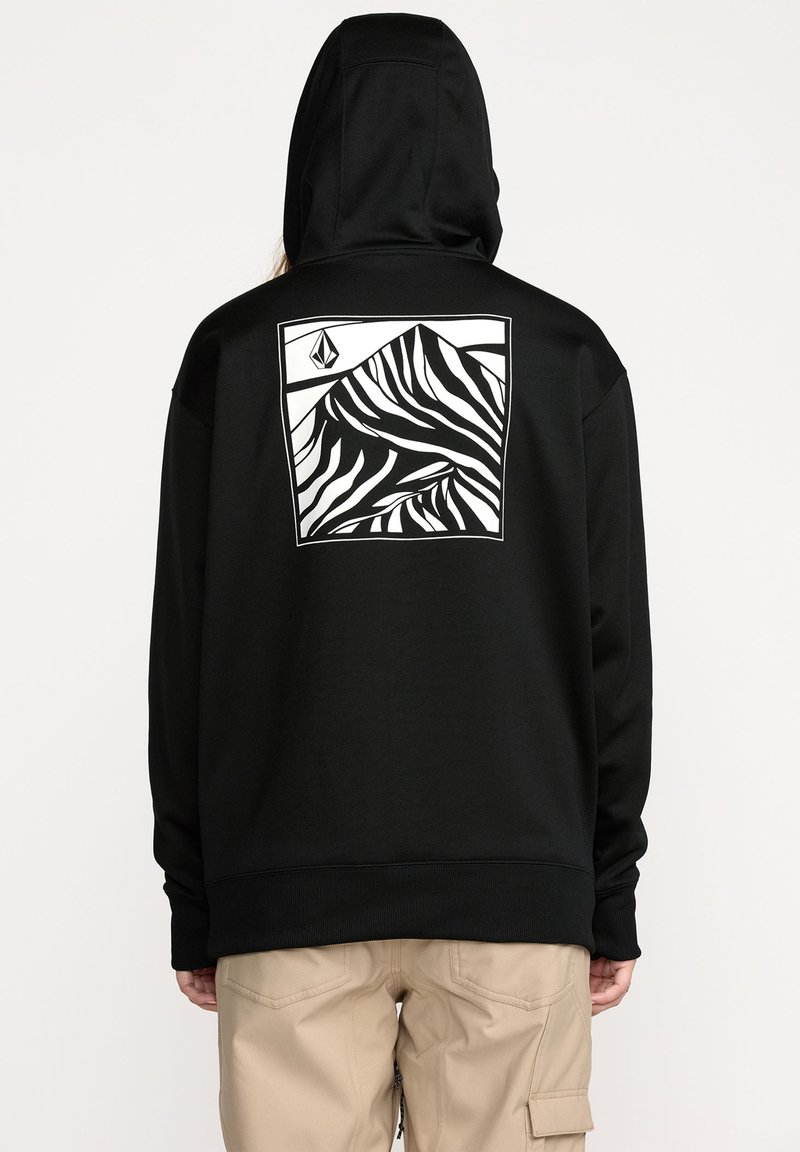 Un sweat à capuche noir avec une poche avant et une finition texturée. Il présente un grand graphique de montagne blanche à l'arrière, encadré dans un carré.
