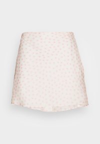 Saia curta feita de um tecido leve e transparente com uma base branca e um pequeno padrão de flores em rosa. Apresenta uma forma ligeiramente evasé e uma bainha em formato de ondulação.