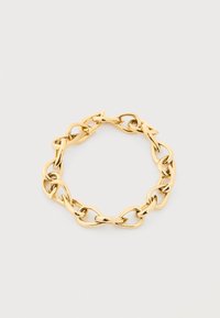Βραχιόλι με αλυσίδα σε χρυσό τόνο με μεγάλους, ακανόνιστους οβάλ κρίκους διατεταγμένους σε κυκλικό σχήμα πάνω σε απλό ανοιχτό φόντο.