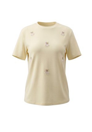 Lys gul T-shirt med korte ærmer, små broderede lyserøde og hvide sløjfer og perle-lignende detaljer spredt på forsiden.