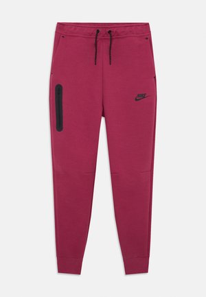 Pantalons de survêtement bordeaux avec une taille élastique à cordon, une poche latérale zippée, des poignets côtelés et un logo Nike noir sur la cuisse gauche.
