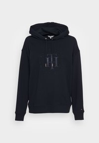 Sudadera negra de mezcla de algodón, con un gran logotipo embosado en la parte frontal, cordones ajustables y puños acanalados.