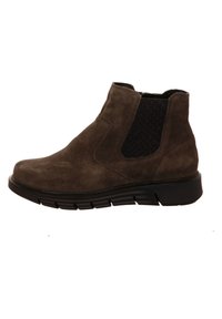 Braune Wildleder-Ankle Boots mit elastischen Seitenpartien, abgerundeter Spitze und einer dicken schwarzen Gummisohle für Grip und Komfort.