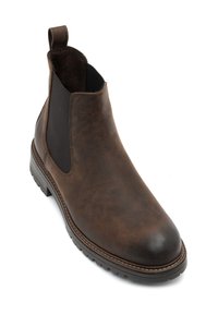 Botín de cuero marrón hasta el tobillo con paneles laterales elásticos, puntera redonda y superficie texturizada. Cuenta con una lengüeta y una suela duradera con dibujo.