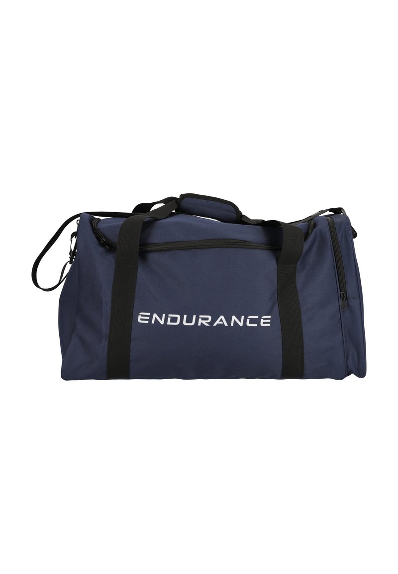 Merikasse, jossa on mustat hihnat, vetoketjullinen tasku ja valkoinen "ENDURANCE" -logo. Kestävä kangas ja rakenteellinen muoto. Säädettävä olkahihna.