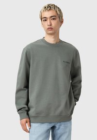 Olivgrön sweatshirt med långa ärmar, rund halsringning och ribbade muddar; har "ALLSAINTS"-logotypen på bröstet. Materialet är mjuk bomull.