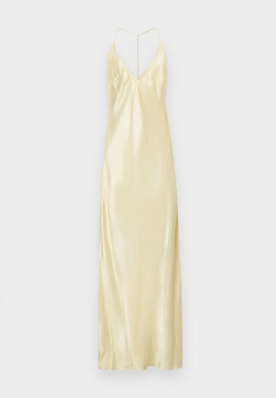 Szatén hálóing világos sárga színben, V nyakkivágással, vékony pántokkal és hosszú, légies sz Siluettel. Texturált felülettel és oldalsó hasítékkal rendelkezik.