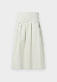 Lys beige skjørt laget av mykt, lett stoff. Har et høyt elastisk liv, folder og en avslappet A-linje silhuett.